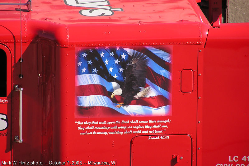 eagle graphic and Bible verse on Ray's tow truck 38