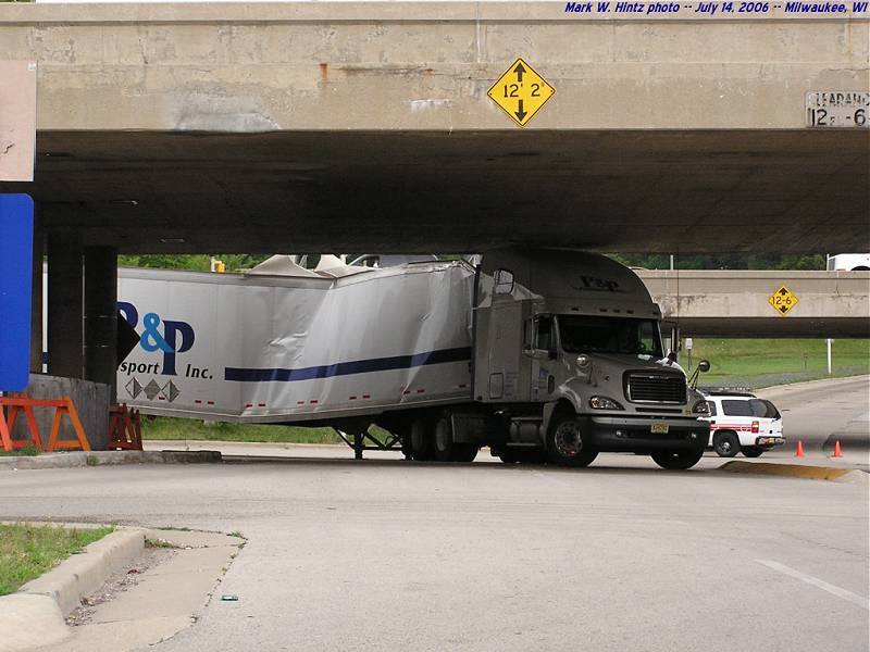 truck stuck under I-94 at Mitchell Blvd.