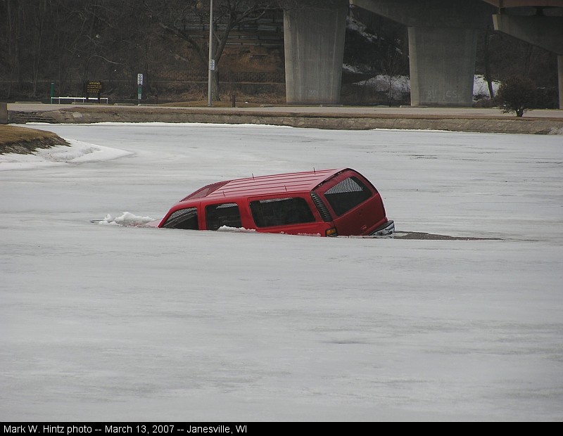 Suburban sinking into a lagoon in Janesville, WI