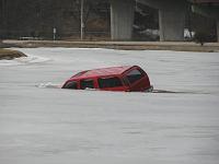 Suburban sinking into a lagoon in Janesville, WI