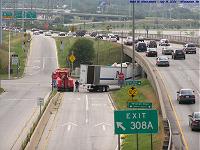 truck stuck under I-94 at Mitchell Blvd.