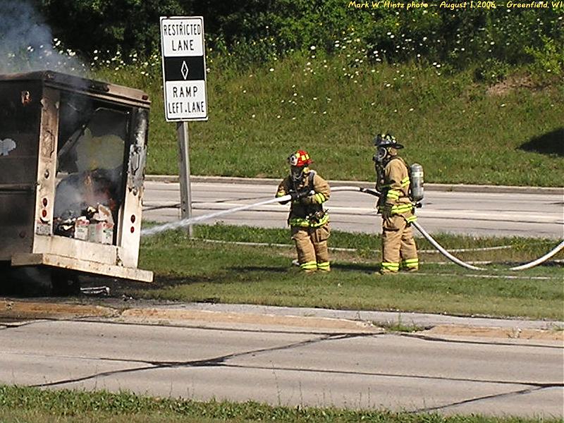 firemen extinguishing the ITU truck fire