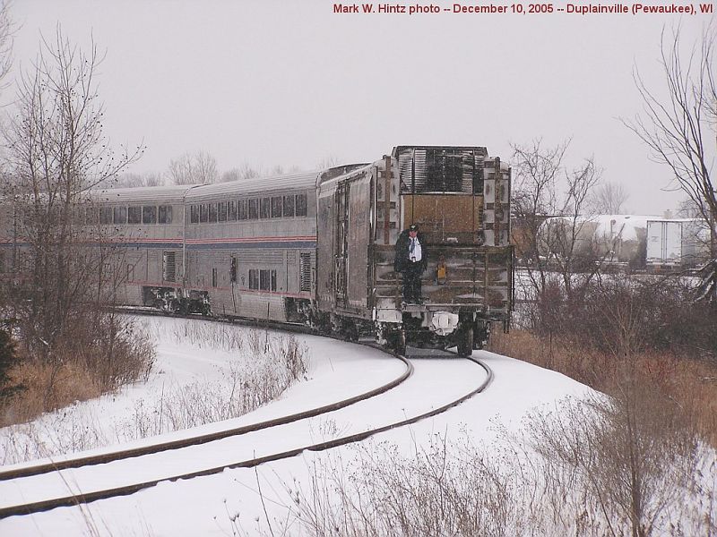 Amtrak conductor rides the platform on AMTK 74029