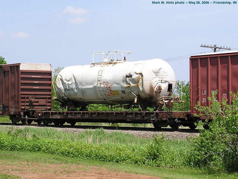 IC flatcar 907581 loaded with DOWX tank car 7163