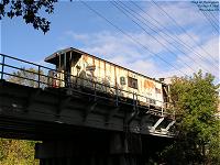 CNW caboose 11186 on the Pine St. bridge