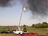 photographer using a cherrypicker to get photos of the Watertown Tire Fire